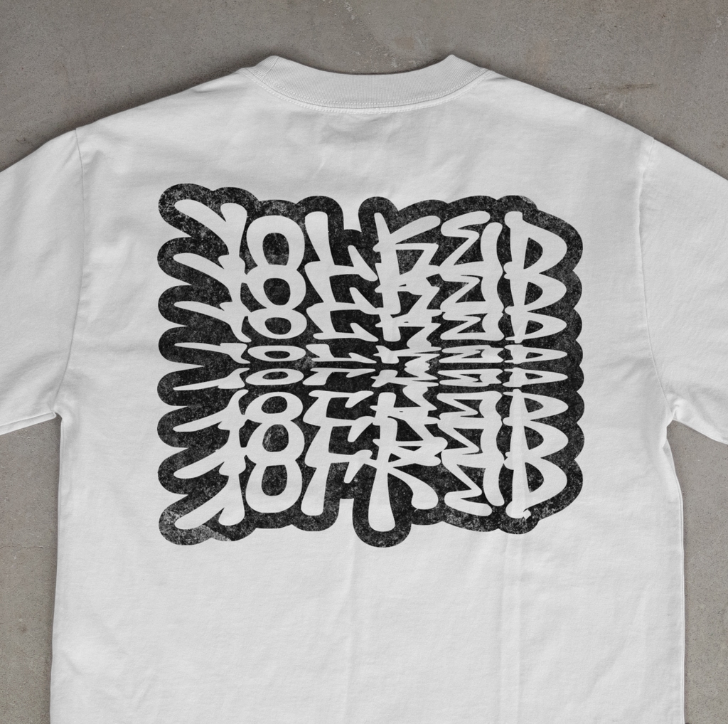 Yolked Apparel Shirt – Optical Illusion Typography Tee, Graphic T-Shirt, Repeating Text Unisex Streetwear